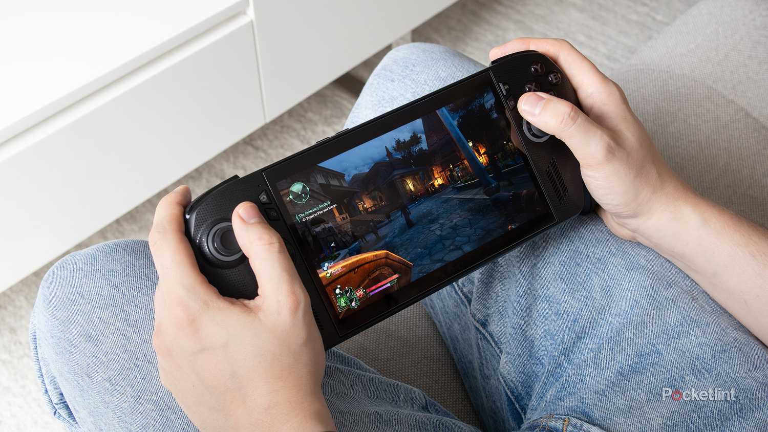 Holding the Xbox Ally X with Avowed running on it 