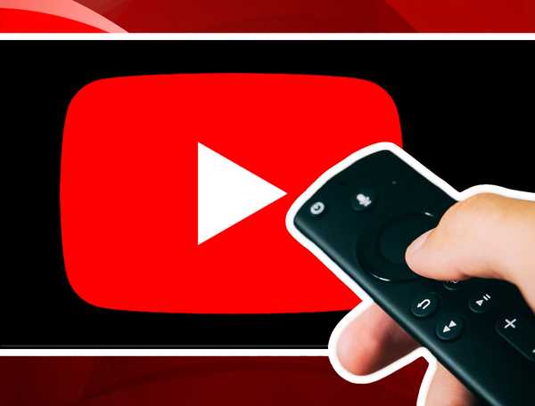 Person holding TV remote in front of TV with YouTube app on it.